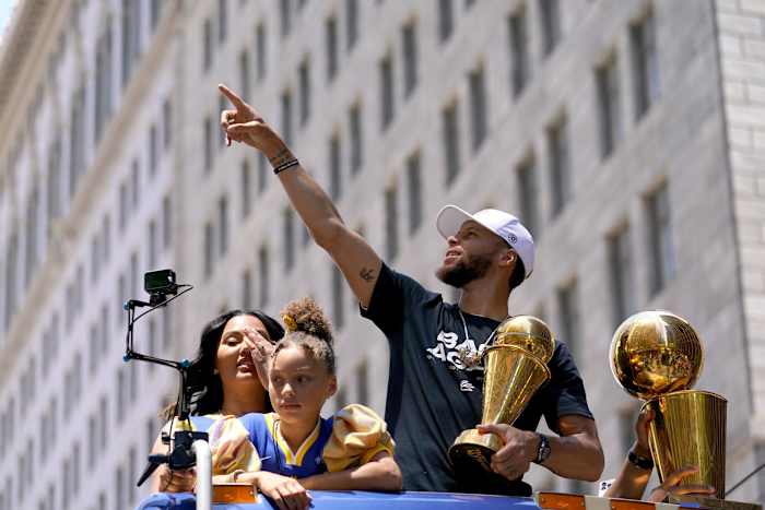 Jun 20, 2022; San Francisco, CA, USA; Golden State Warriors guard Stephen Curry points to fans during the Warriors championship parade in downtown San Francisco. Mandatory Credit: Cary Edmondson-USA TODAY Sports